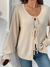 Beige lace-up balloon sleeve knitted sweater with front detailing
