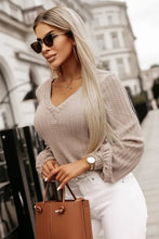 Beige textured lantern sleeve blouse with V-neck design