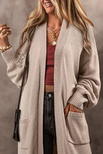 Beige long-sleeved cardigan with pockets and ribbed cuffs