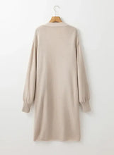 Beige sweater dress with ribbed cuffs, hem, pockets, and oversized cardigan style