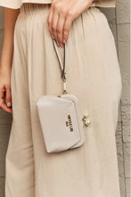Beige Pebbled Vegan Leather Clutch with Pearl Accent and Wrist Strap Wallets