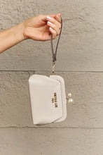 Beige Pebbled Vegan Leather Clutch with Pearl Accent and Wrist Strap Wallets