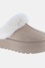Beige suede platform snow slippers with white faux fur trim