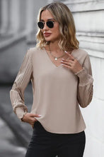 Beige pleated lantern sleeve blouse with v-neck and lace cuffs