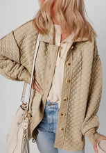 Beige quilted jacket with seam collared neck button and fur-lined hood