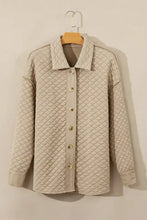 Beige quilted jacket with seam collared neck button closure