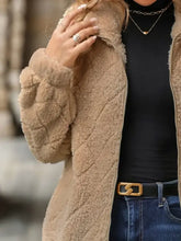 Beige quilted teddy jacket with fuzzy pocketed zip and gold accents