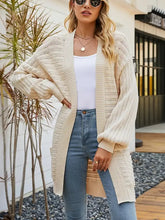 Cardigan beige légèrement extensible avec poches et détails côtelés