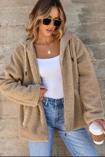 Beige teddy bear coat with hood, zipper, and pockets