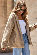 Beige teddy bear coat with hood, long sleeves, and pockets