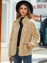 Beige textured faux fur jacket with high collar and long sleeve length