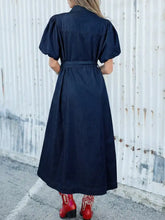Dark blue midi denim dress with puffed sleeves and belted waist in button-down style denim dress