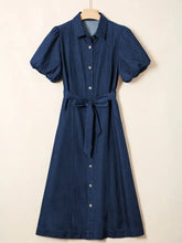 Navy blue belted midi denim dress with collar button-front closure and puffed short sleeves