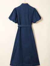Navy blue midi denim dress with puffed short sleeves and matching belt button-down style