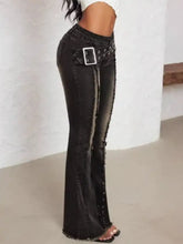 Black distressed belted high waist flare jeans with studded belt loop and silver buckle in denim material