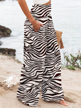 Plus size zebra print high waist wide leg pants in black and white flowing fabric with a high-waisted design