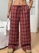 Maroon and cream plaid wide leg pants with elastic waistband and drawstring for comfortable casual wear