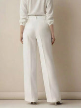 White high-waisted wide leg pants with a sleek tailored fit and subtle front pleats ideal for formal wear
