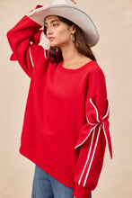Red fleece blend BiBi bow detail sleeves fleece sweatshirt with white striped cuffs ideal for casual pairing tips