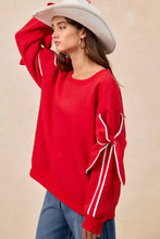 Bi bi bow detail fleece blend sweatshirt in red with white ribbon bows at cuffs and matching sleeve stripes pairing tips