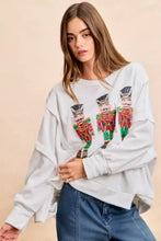 White oversized sweatshirt with sequin nutcrackers embroidery in red green and gold by BiBi Christmas collection