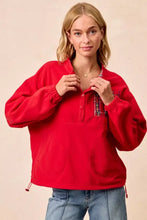 Red fleece buttoned pullover with plaid collar detail and drawstring hem from bibi christmas fleece buttoned collection with pockets care instructions