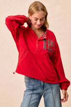 Red long-sleeved fleece buttoned top with plaid patch pocket from bibi christmas collection with care instructions