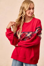 Red BiBi Christmas theme plaid block sweatshirt featuring a red body with plaid pattern sleeves and binding details