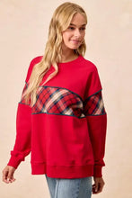 Red bibi christmas plaid block sweatshirt with binding featuring a plaid pattern across shoulders and upper arms