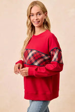 Red long-sleeved BiBi Christmas sweatshirt with plaid block panel and navy trim for festive winter wear