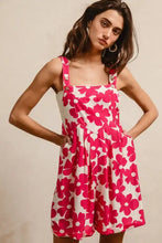 BiBi vibrant pink floral print romper with square neckline and pockets