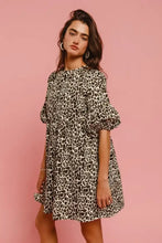 BiBi leopard denim dress featuring short sleeves, gathered neckline, puff sleeves, and back contrast tie detail