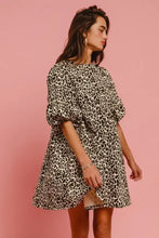 Bi bi leopard denim dress featuring a relaxed fit short-sleeved leopard print and flared skirt design