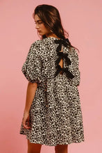 BiBi leopard denim dress with black and white leopard print, puffed sleeves, and back contrast tie detail visible from back