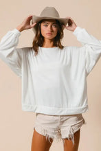 White oversized loop terry sweatshirt with cut edge band and ribbed cuffs in a relaxed fit design