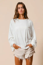 White oversized long-sleeve BiBi loop terry sweatshirt with relaxed fit ribbed cuffs and cut edge band detailing