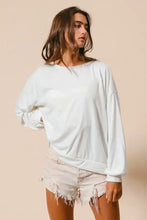 White oversized long-sleeve loop terry sweatshirt with relaxed fit ribbed cuffs and cut edge band detailing