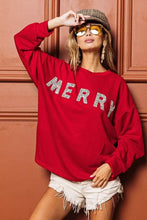 Red long-sleeved sweatshirt with merry in sparkling silver letters and relaxed drop shoulder design by bibi