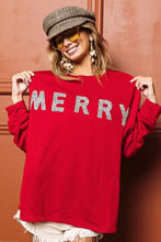 Red long-sleeved drop shoulder sweater with merry spelled in silver glitter letters by bibi merry glitter Christmas top
