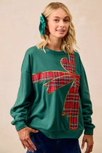 Green fleece pullover with large red plaid bow and gold trim for the best fit christmas fleece pullover look
