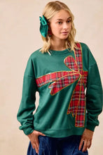 Green fleece pullover featuring a large red plaid ribbon bow with gold trim perfect for the best fit christmas fleece pullover