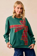 Green BiBi fleece pullover with a large red and black plaid bow detail and gold trim ideal for a christmas fleece pullover