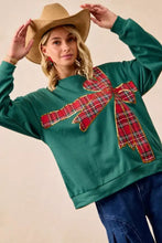 Green fleece pullover with a large red plaid bow appliqué and gold trim best fit for christmas fleece pullover wear