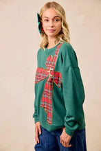 Green fleece pullover with a large red plaid bow appliqué on the chest perfect for christmas best fit