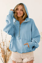 Light blue BiBi fleece hoodie with relaxed fit, elastic hem, zip-up front, and convenient front pockets