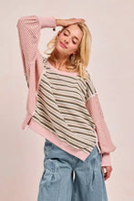 A soft pink and beige biBi stripe long-sleeved top with cut edge detailing and a reverse outseam hemline