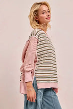 A soft pink and olive green bibi stripe oversized sweatshirt with cut edge and reverse outseam detailing