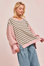 Pastel pink and olive green bibi stripe oversized sweater with cut edge and reverse outseam solid pink sleeves