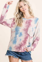 A slightly stretchy bibi tie dye print terry top in pastel pink and blue with a relaxed fit and front patch pocket