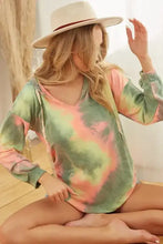 A soft long-sleeved bi bi tie dye terry hoodie in pastel green and pink with v-neckline and twill tape drawstring
